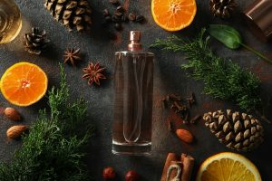 Concept of natural perfume on dark textured background